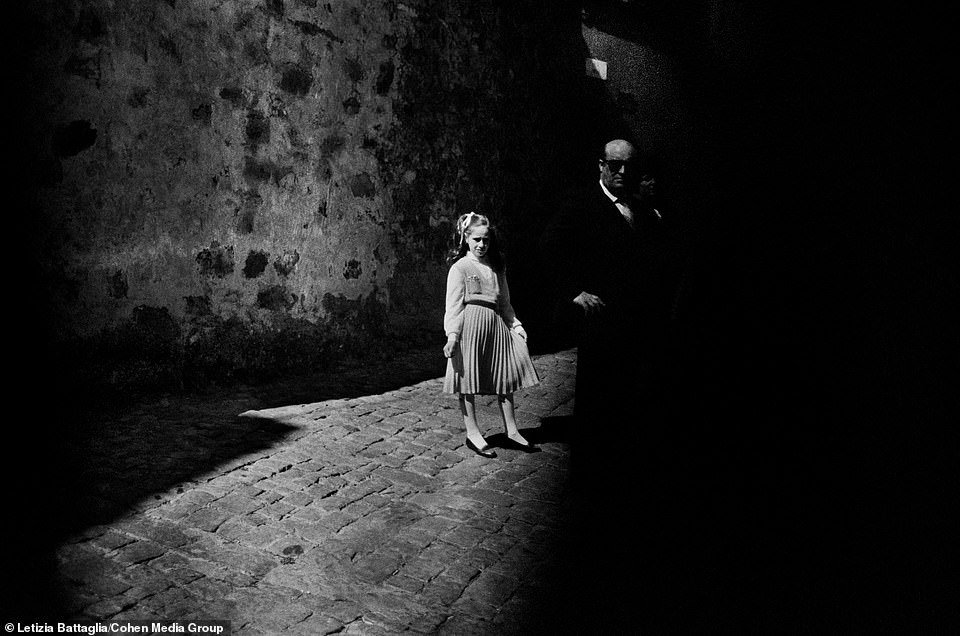 21569120 7734533 A young girl stands beside a su