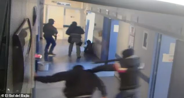 21695132 7745383 Heavily armed with assault rifles the seven masked assailants be a 66 1575266477725