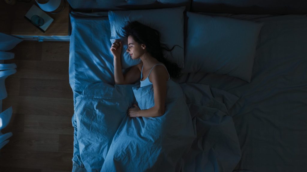 woman sleeping bed getty 0322 2000