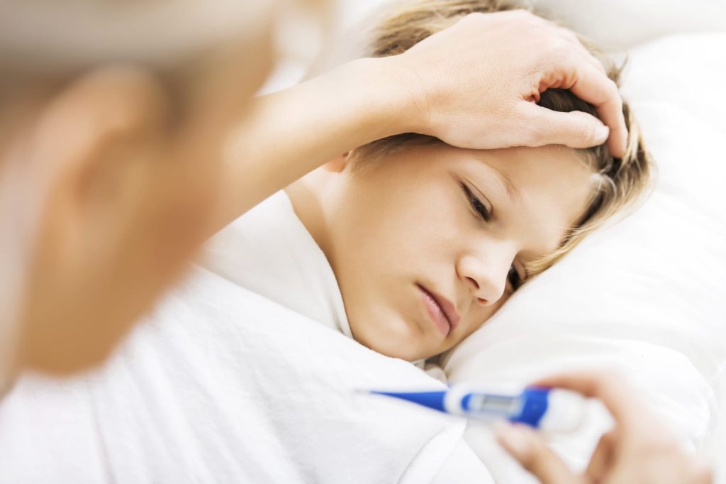 iStock sick boy thermometer Medium
