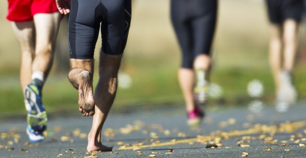 athlete compete in a running race barefoot royalty free image 1666961971
